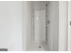 Clean, bright white shower with built-in shelving for storage and chrome fixtures at 604 Clark Lake Estates Dr, Grayson, GA 30017