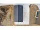 Aerial view of detached garage with concrete driveway and landscaped surroundings at 10 Last St, Moreland, GA 30259