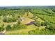 Aerial view of the home showing the private acreage, the pond, and the location at 10 Last St, Moreland, GA 30259