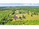 Beautiful aerial view of the property, the pond, and the surrounding area at 10 Last St, Moreland, GA 30259