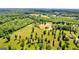 Another great aerial view of the property, the pond, the home, and the shop at 10 Last St, Moreland, GA 30259