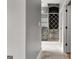 Bright bathroom featuring marble floors, a double sink vanity, and a glass shower at 10 Last St, Moreland, GA 30259