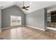 Bonus room with vaulted ceiling, large window, and durable wood-look flooring at 10 Last St, Moreland, GA 30259