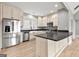 Kitchen featuring stainless steel appliances, island, and stylish backsplash at 10 Last St, Moreland, GA 30259