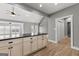 View of kitchen island with black countertop and cream cabinets at 10 Last St, Moreland, GA 30259