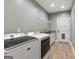 Laundry room featuring new Maytag washer and dryer, granite countertop, and storage at 10 Last St, Moreland, GA 30259