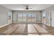 Open living room with hardwood floors, recessed lighting, and bright natural light at 10 Last St, Moreland, GA 30259