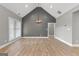 Spacious living room with luxury vinyl plank flooring and vaulted ceiling at 10 Last St, Moreland, GA 30259