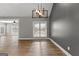 Bright living room boasts hardwood floors, neutral walls, and modern lighting at 10 Last St, Moreland, GA 30259
