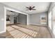 Open living room with hardwood floors, recessed lighting, and view of the kitchen at 10 Last St, Moreland, GA 30259