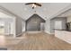 Spacious living room with luxury vinyl plank flooring and vaulted ceiling at 10 Last St, Moreland, GA 30259