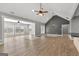 Spacious living room with luxury vinyl plank flooring and vaulted ceiling at 10 Last St, Moreland, GA 30259