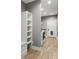 Mudroom with white storage shelves, bench, and door with a pet door at 10 Last St, Moreland, GA 30259