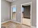 Bright, gray-painted room with a window and an open door leading to the outside at 10 Last St, Moreland, GA 30259