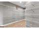 Spacious walk-in closet with ample shelving, perfect for organizing and storing clothes and accessories at 10 Last St, Moreland, GA 30259