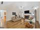 Inviting living room features a vaulted ceiling, brick fireplace, and hardwood flooring at 160 Vinnys Way, Covington, GA 30014