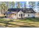 Spacious backyard with a large grassy area and a gazebo with seating, perfect for entertaining at 1012 Matthews Way, Mcdonough, GA 30252