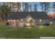 Spacious backyard featuring a gazebo, seating, and a grill, perfect for entertaining guests at 1012 Matthews Way, Mcdonough, GA 30252