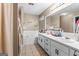 Neutral bathroom with dual sinks, large vanity, and a seperate soaking tub at 1012 Matthews Way, Mcdonough, GA 30252