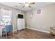 Neutral bedroom with hard wood floors and features a window with lots of natural light at 1012 Matthews Way, Mcdonough, GA 30252