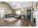 Inviting living room with high ceilings, a cozy fireplace, and stylish flooring perfect for relaxing and entertaining at 1012 Matthews Way, Mcdonough, GA 30252