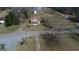 Aerial view of a home near a road, surrounded by trees and greenery at 1269 Snapping Shoals Rd, Mcdonough, GA 30252