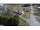 Aerial view of house and property on a sunny day, set amidst trees and a quiet road at 1269 Snapping Shoals Rd, Mcdonough, GA 30252