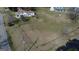 An aerial perspective of a home surrounded by a lush lawn, showcasing a spacious lot and quiet neighborhood streets at 1269 Snapping Shoals Rd, Mcdonough, GA 30252