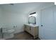 Bright bathroom featuring a double vanity with modern finishes and wood look flooring at 1269 Snapping Shoals Rd, Mcdonough, GA 30252