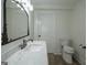 Bathroom featuring marble countertop, modern sink, and white walls at 1269 Snapping Shoals Rd, Mcdonough, GA 30252