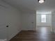 Spacious room showcasing hardwood floors and natural light from the window at 1269 Snapping Shoals Rd, Mcdonough, GA 30252