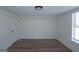 Light-filled room with wood floors, neutral walls, and a window providing ample natural light at 1269 Snapping Shoals Rd, Mcdonough, GA 30252