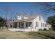 Exterior view of home with shutters, ample yard space and a covered porch at 1269 Snapping Shoals Rd, Mcdonough, GA 30252