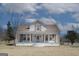 Charming front exterior featuring a welcoming porch and landscaped yard at 1269 Snapping Shoals Rd, Mcdonough, GA 30252