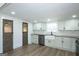Beautifully remodeled kitchen boasts a farmhouse sink, stainless steel appliances, and shaker cabinets at 1269 Snapping Shoals Rd, Mcdonough, GA 30252