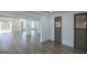 Spacious living room with hardwood floors is adjacent to a sliding door and rustic-style door at 1269 Snapping Shoals Rd, Mcdonough, GA 30252