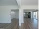 Spacious living room with hardwood floors is adjacent to the modern kitchen with stainless steel appliances at 1269 Snapping Shoals Rd, Mcdonough, GA 30252