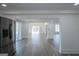 Bright living room with an open floor plan and hardwood floors near the kitchen area at 1269 Snapping Shoals Rd, Mcdonough, GA 30252