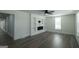 Open-concept living space with hardwood floors, a ceiling fan, and modern finishes at 1269 Snapping Shoals Rd, Mcdonough, GA 30252