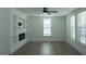 Bright room featuring hardwood floors, recessed lighting, and large windows at 1269 Snapping Shoals Rd, Mcdonough, GA 30252