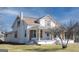 Side exterior of home with white painted brick foundation and inviting front porch at 1269 Snapping Shoals Rd, Mcdonough, GA 30252