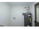 Clean utility room featuring a new hot water heater with modern fittings and updated electrical components at 1269 Snapping Shoals Rd, Mcdonough, GA 30252
