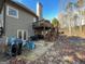 Backyard patio with grill, table, chairs, and upper-level wood deck featuring space for outdoor gatherings at 306 Oakwind Way, Canton, GA 30114
