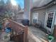 Outdoor deck with a grill, wood pile and access to the yard featuring a patio at 306 Oakwind Way, Canton, GA 30114
