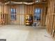 Unfinished basement with framing and natural light, ready to be transformed into a living space at 306 Oakwind Way, Canton, GA 30114