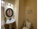Small half bathroom with pedestal sink and decorative lighting at 306 Oakwind Way, Canton, GA 30114
