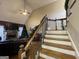 Cozy living room showcasing high ceilings, festive decor and a staircase to the second floor at 306 Oakwind Way, Canton, GA 30114