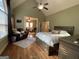 Main bedroom with high ceilings, en-suite bathroom, and a cozy sitting area at 306 Oakwind Way, Canton, GA 30114