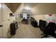 Large home office space features vaulted ceilings and space for multiple desks at 306 Oakwind Way, Canton, GA 30114