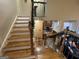 Hardwood staircase with ornate wood railing, leading to the upper level of the home overlooking the kitchen at 306 Oakwind Way, Canton, GA 30114